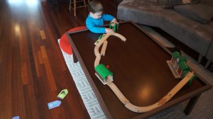 Henry builds a train track.Still001